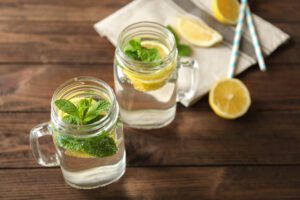 mason jars of lemonade with paper straws