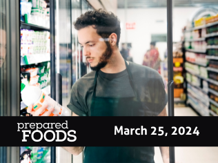 man looks at beverage label at grocery store