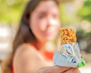 blurry image of woman with in focus snack bar
